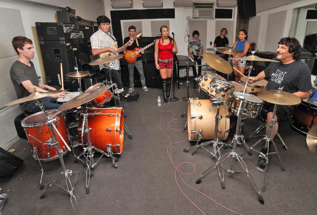 Drummer_Carmine_Appice_(right)_works_with_Basie_Rockit!_students_in_advance_of_their_Vanguard_Awards_performance_on_August_29th.